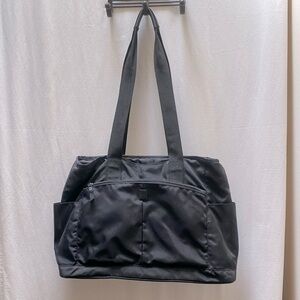 Black nylon travel tote by Anne McAlpin